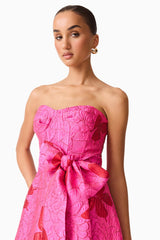 Brunette model wearing The Lorena Jacquard Strapless Gown in Pink close up shot