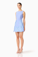 Brunette model wearing the Janelle Mini Dress in Blue side shot