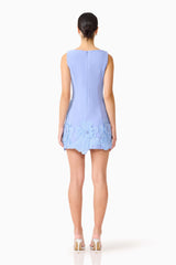Brunette model wearing the Janelle Mini Dress in Blue back shot