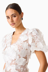 Brunette model wearing Zayla 3D Floral Mini Dress close up posed detail shot