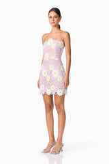 Brunette model wearing SIGRID STRAPLESS MINI DRESS side shot