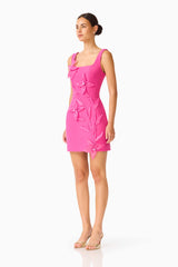 Brunette model wearing the Ilaria Party Mini Dress in Pink side shot