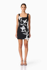 Brunette model wearing ILARIA MINI DRESS in black front shot