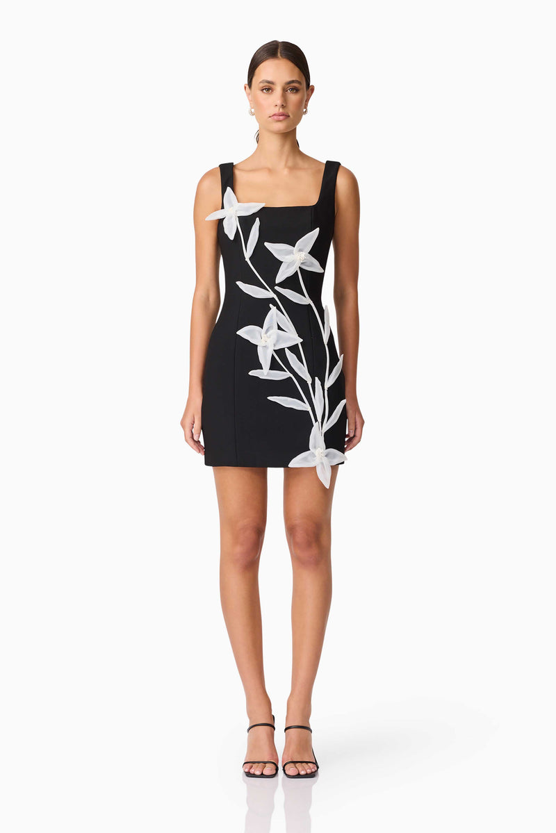 Brunette model wearing ILARIA MINI DRESS in black front shot