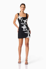 Brunette model wearing ILARIA MINI DRESS in black front shot hands on hip