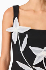 Brunette model wearing ILARIA MINI DRESS in black detailing shot