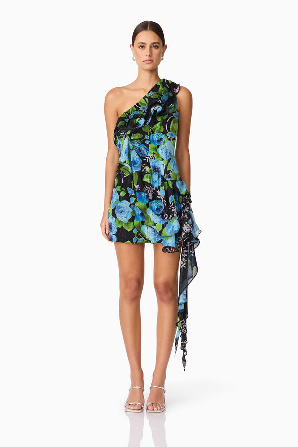 Brunette Model Wearing Briony Asymmetrical Mini Dress in Black & Blue Floral Front Shot