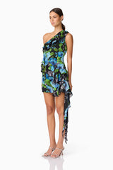 Brunette Model Wearing Briony Asymmetrical Mini Dress in Black & Blue Floral Side Shot