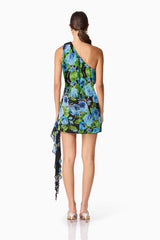 Brunette Model Wearing Briony Asymmetrical Mini Dress in Black & Blue Floral Back Shot