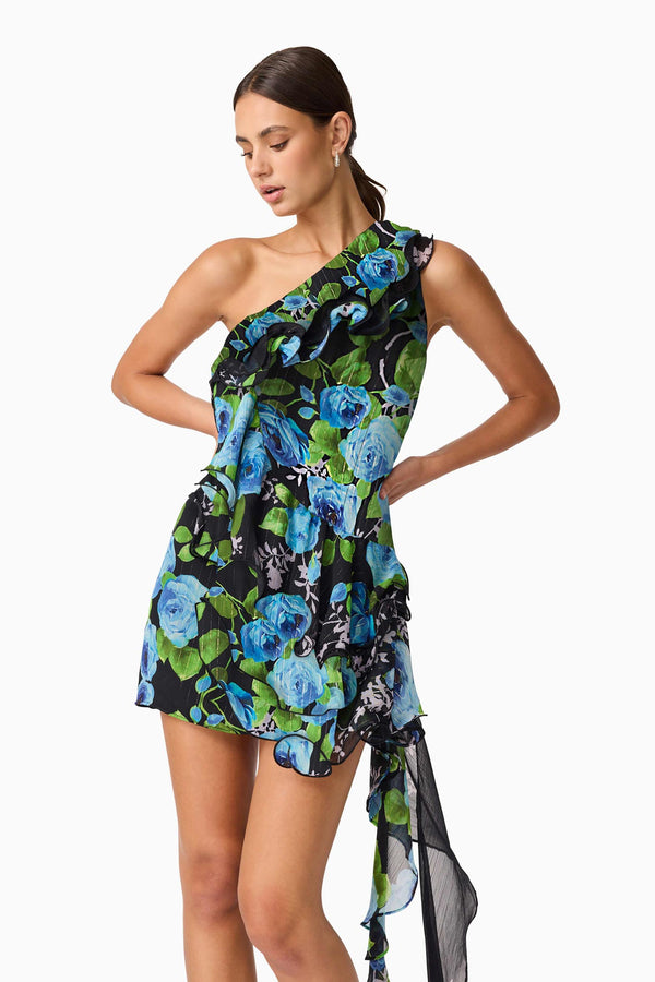 Brunette Model Wearing Briony Asymmetrical Mini Dress in Black & Blue Floral Close Up Shot