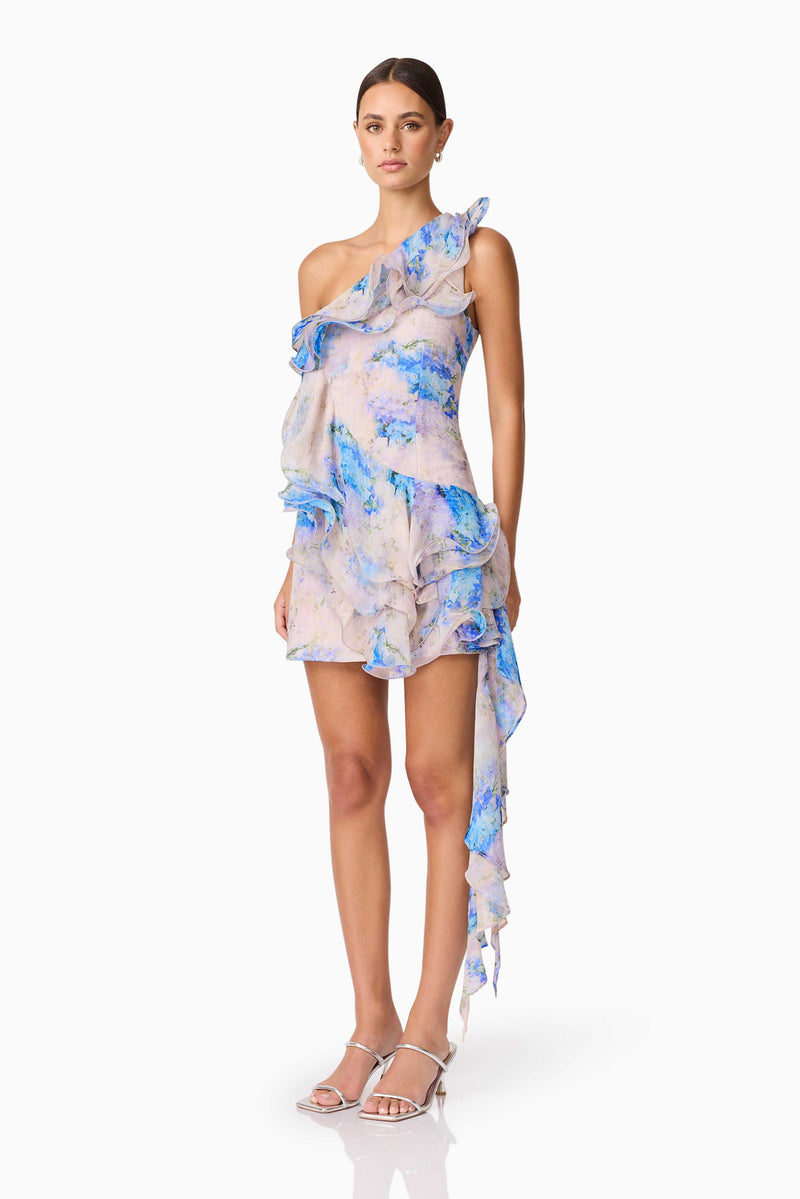 Brunette Model Wearing Briony Asymmetrical Mini Dress in Floral Side Shot