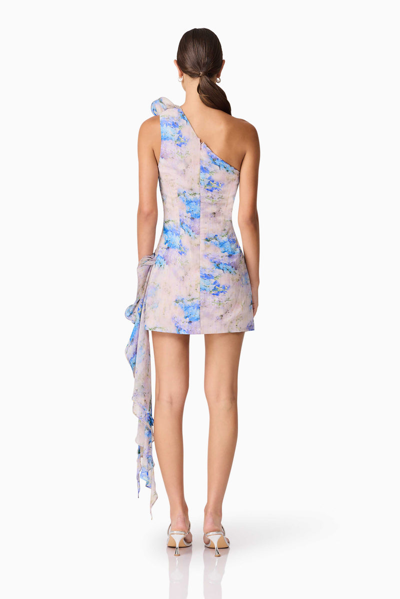 Brunette Model Wearing Briony Asymmetrical Mini Dress in Floral Back Shot