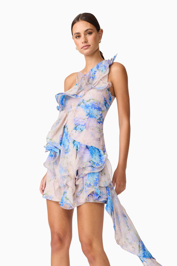 Brunette Model Wearing Briony Asymmetrical Mini Dress in Floral Close Up Shot
