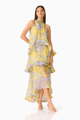 Brunette model wearing the Briony Tiered Gown in Yellow Print posed hand on hip shot