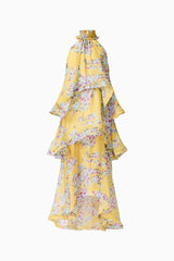 Brunette model wearing the Briony Tiered Gown in Yellow Print ghost shot