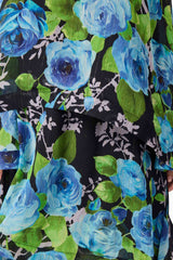 Blonde model wearing the Briony Tiered Gown in Black & Blue Floral detail shot