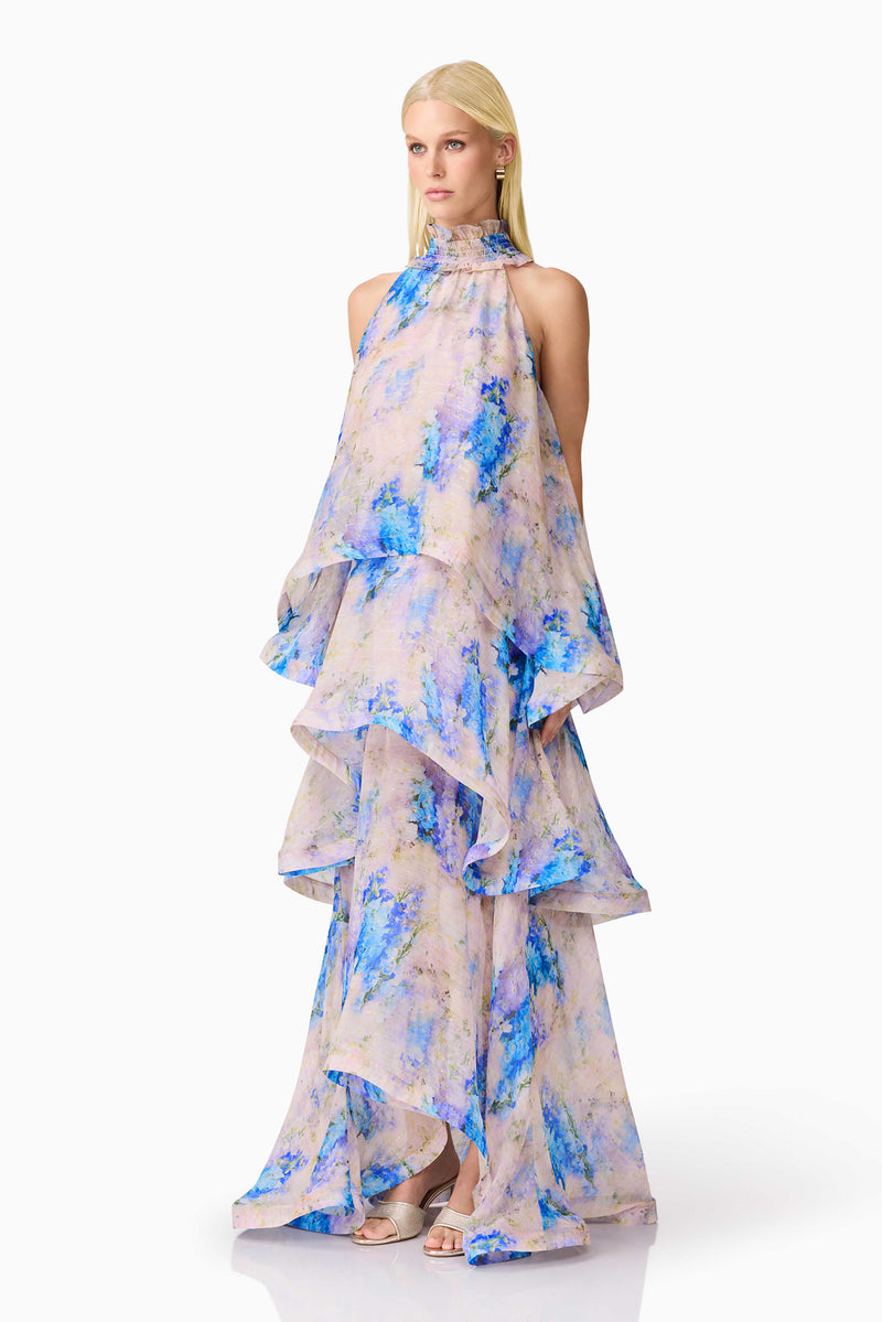 Blonde Model wearing Briony Tiered Gown in Pink & Blue Floral side shot