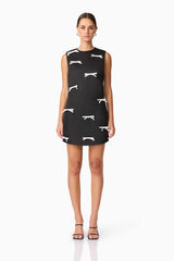Brunette model wearing Ursula Mini Shift Dress in Black front shot