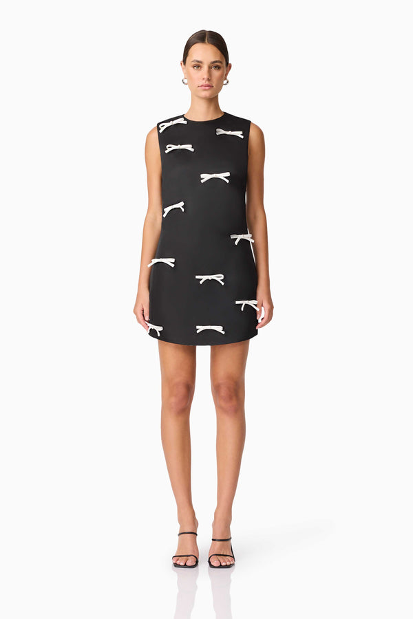Brunette model wearing Ursula Mini Shift Dress in Black front shot