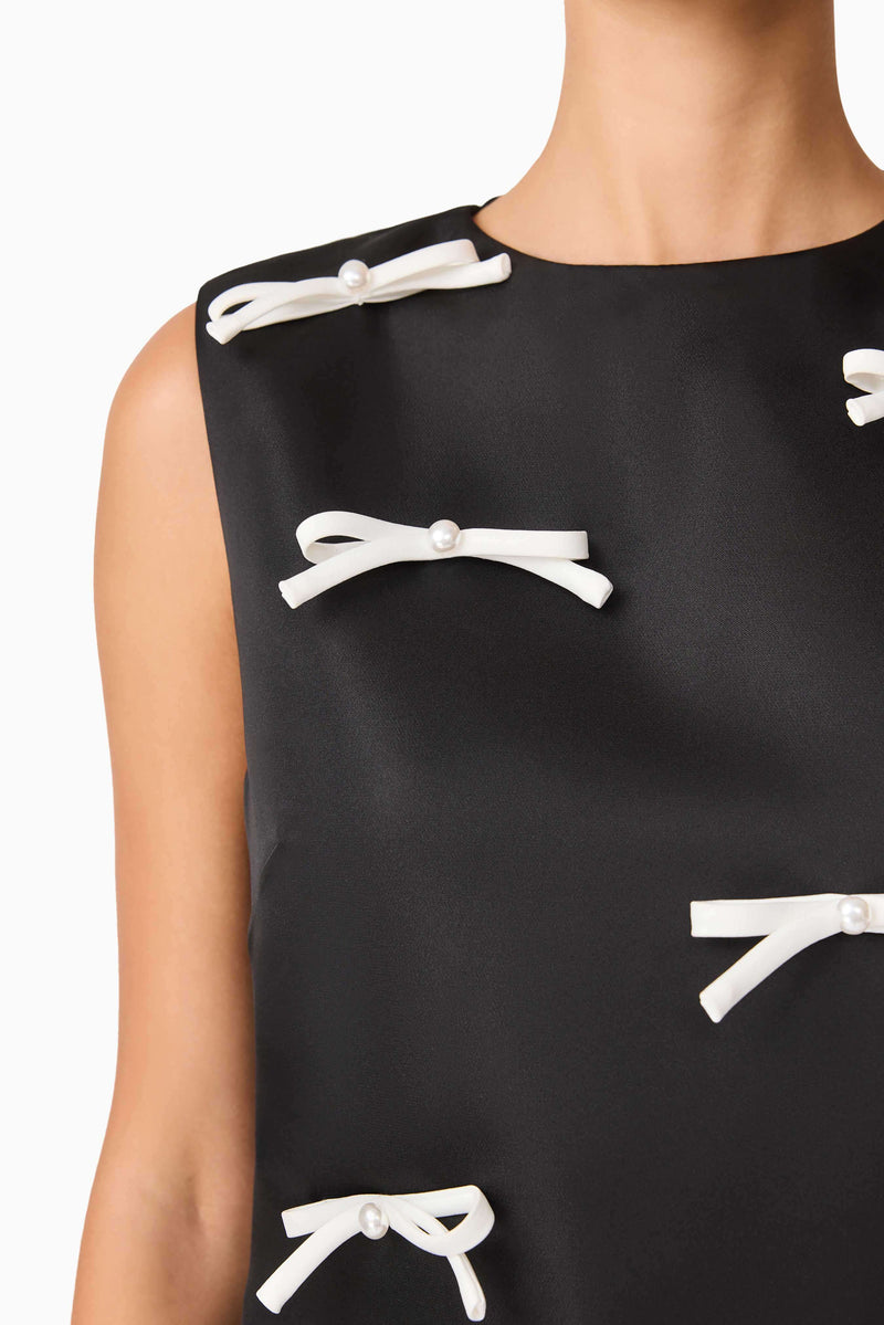 Brunette model wearing Ursula Mini Shift Dress in Black detail shot