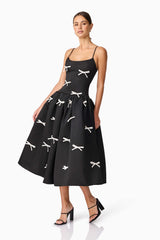 Brunette model wearing Ursula A-Line Midi Dress in Black posed shot