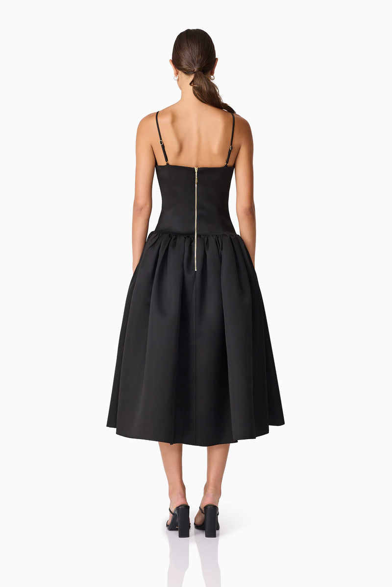 Brunette model wearing Ursula A-Line Midi Dress in Black back shot