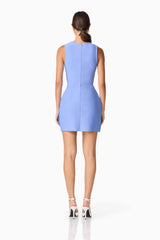 Brunette model wearing Sonya Tulip Mini Dress in Blue back shot