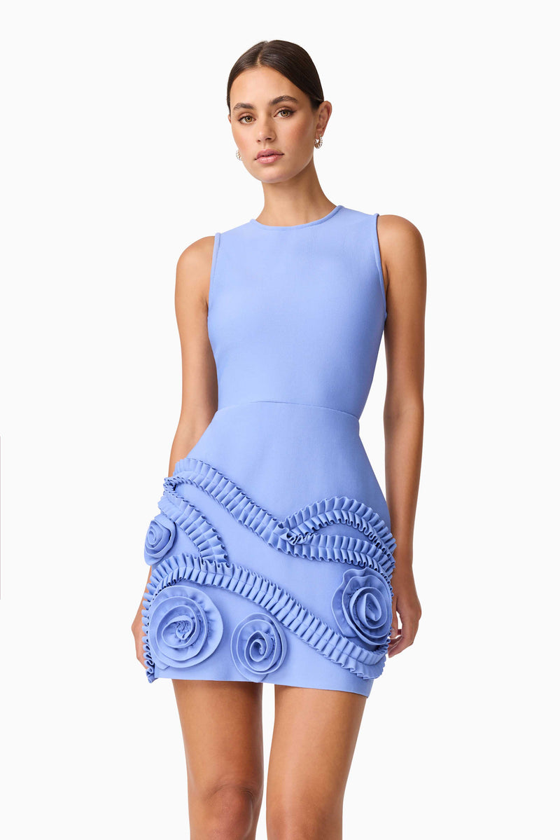 Brunette model wearing Sonya Tulip Mini Dress in Blue close up shot