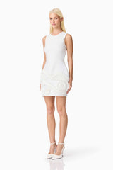 Blonde model wearing the Sonya Tulip Mini Dress in White side shot