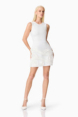 Blonde model wearing the Sonya Tulip Mini Dress in White posed shot