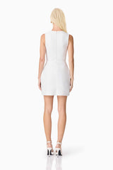 Blonde model wearing the Sonya Tulip Mini Dress in White back shot