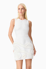 Blonde model wearing the Sonya Tulip Mini Dress in White close up looking away shot