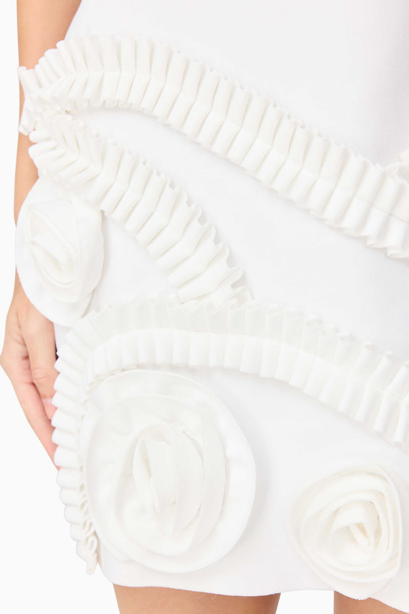 Blonde model wearing the Sonya Tulip Mini Dress in White detail shot