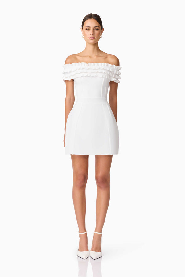 Brunette model wearing Sonya Off The Shoulder Mini Dress in White front shot