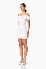 Brunette model wearing Sonya Off The Shoulder Mini Dress in White side shot