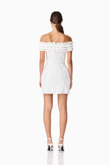 Brunette model wearing Sonya Off The Shoulder Mini Dress in White back shot