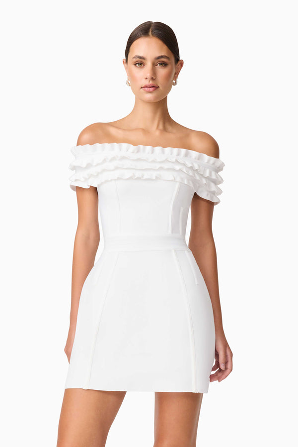 Brunette model wearing Sonya Off The Shoulder Mini Dress in White close up shot