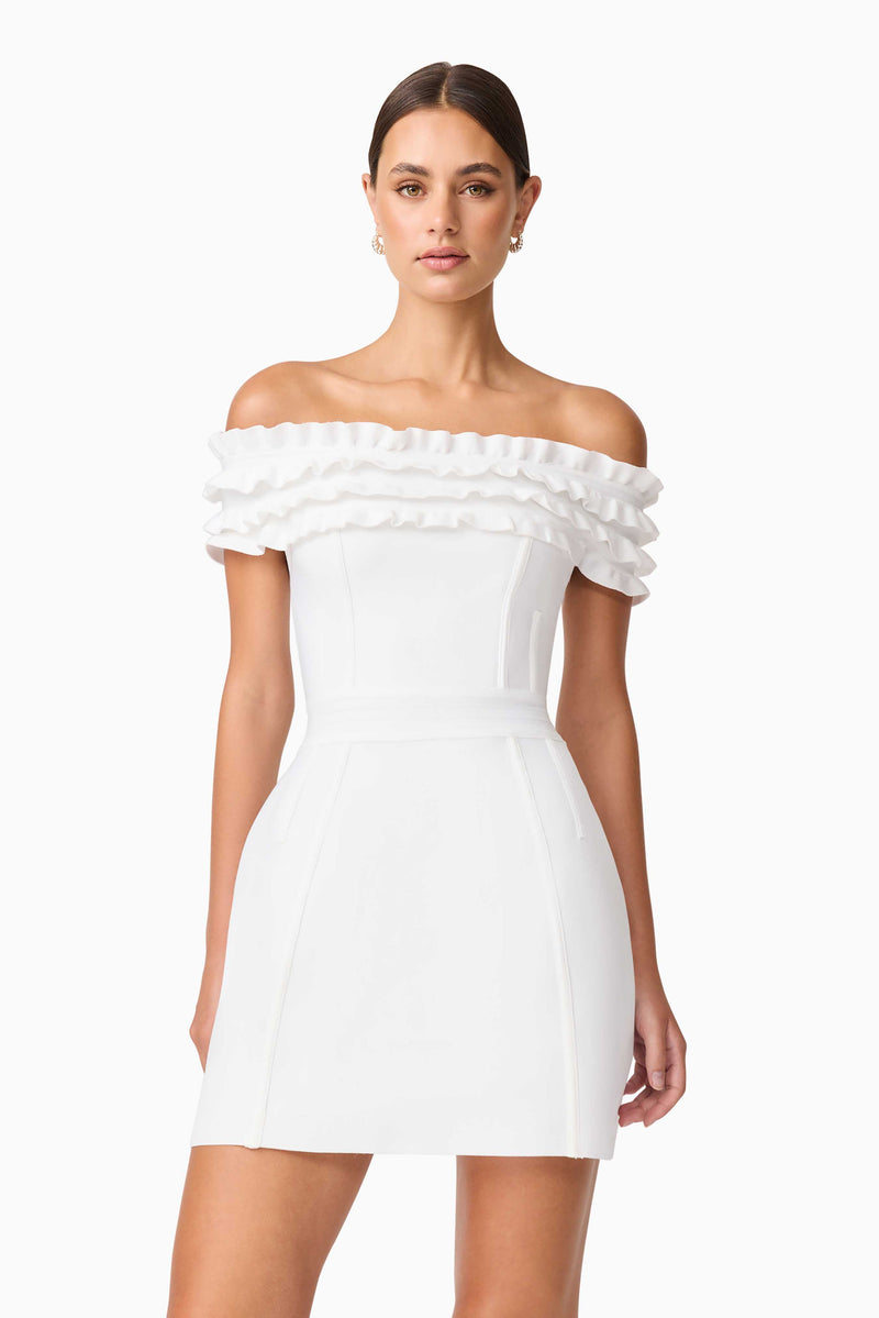 Brunette model wearing Sonya Off The Shoulder Mini Dress in White close up shot