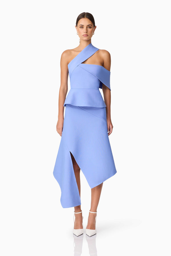Brunette model wearing Sonya Asymmetrical Set in Blue front shot