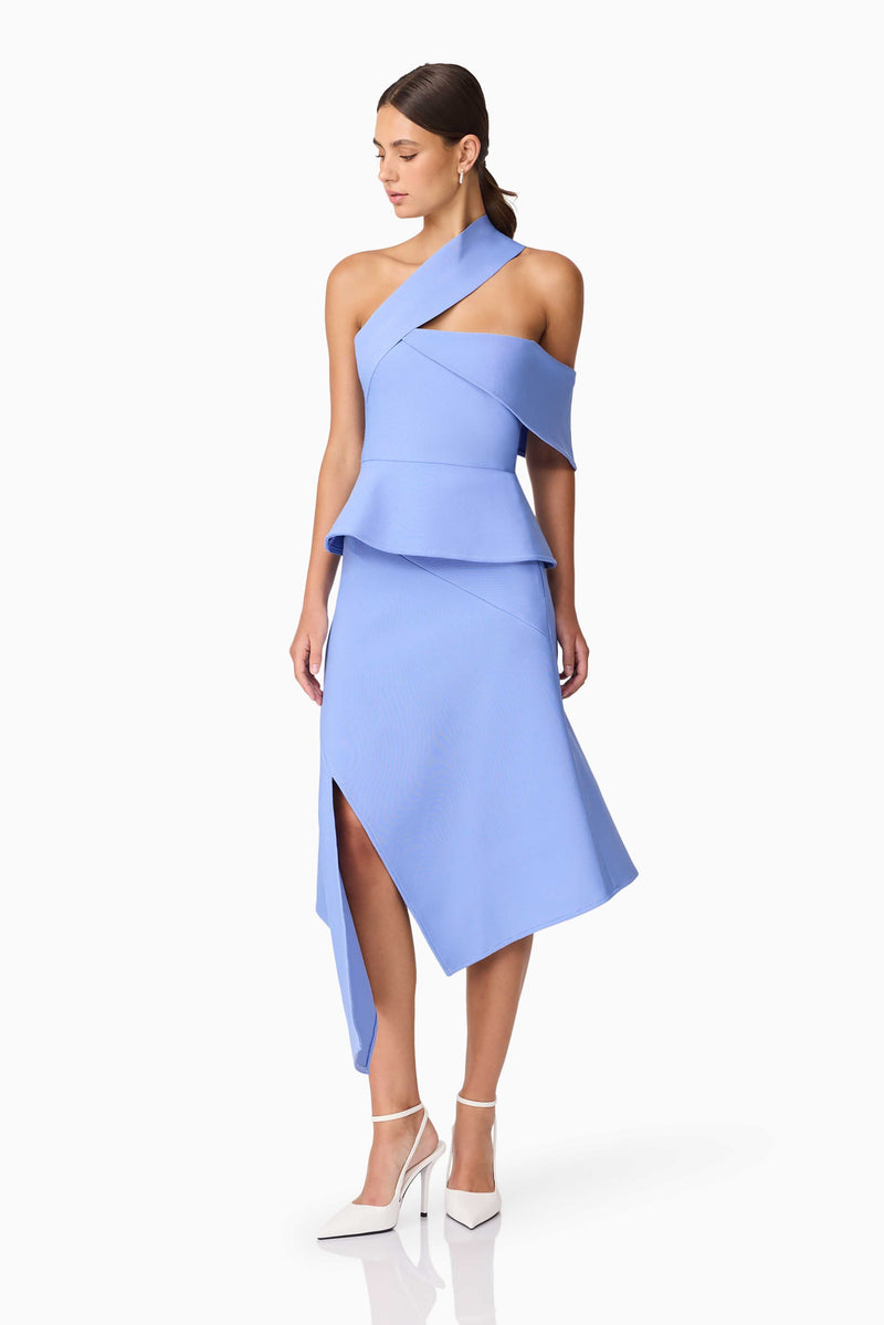 Brunette model wearing Sonya Asymmetrical Set in Blue posed shot