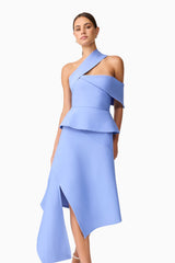 Brunette model wearing Sonya Asymmetrical Set in Blue close up shot