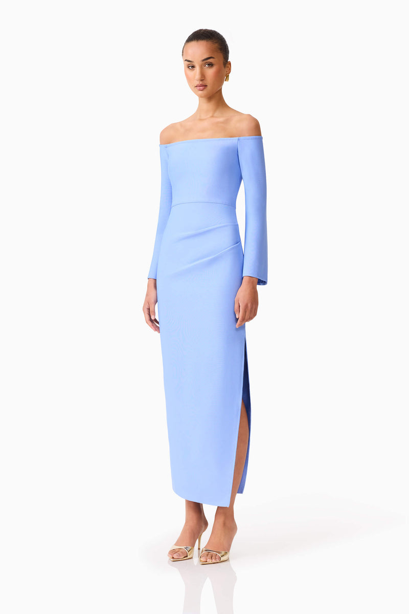 Brunette model wearing Sonya Long Sleeve Midi Dress in Blue side shot