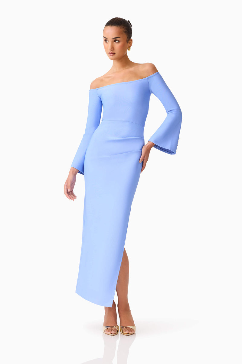 Brunette model wearing Sonya Long Sleeve Midi Dress in Blue posed front shot hand on hip