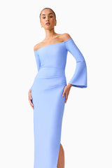 Brunette model wearing Sonya Long Sleeve Midi Dress in Blue zoomed posed shot