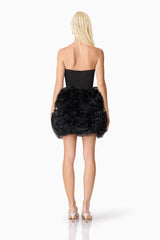 Blonde model wearing Asher Strapless Mini Dress in Black back shot