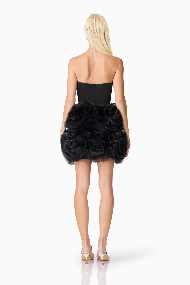 Blonde model wearing Asher Strapless Mini Dress in Black back shot