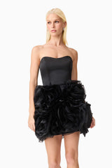 Blonde model wearing Asher Strapless Mini Dress in Black close up shot