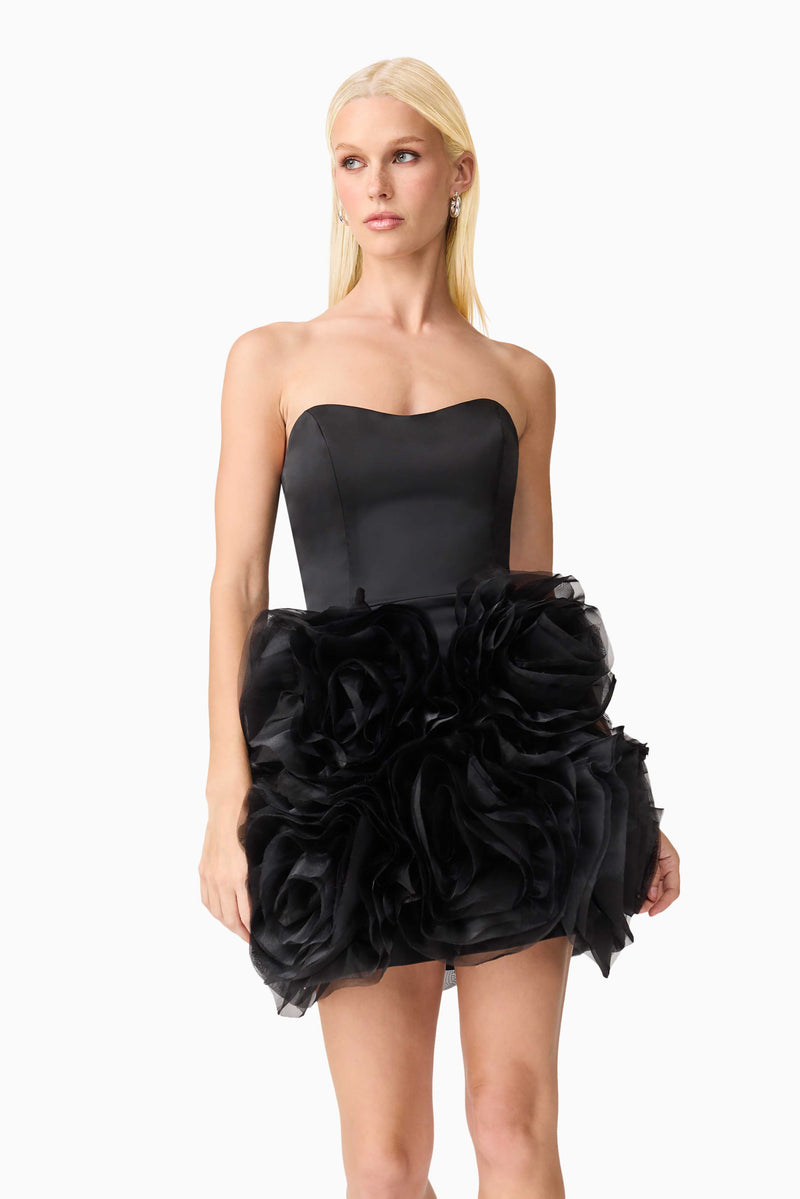 Blonde model wearing Asher Strapless Mini Dress in Black close up shot