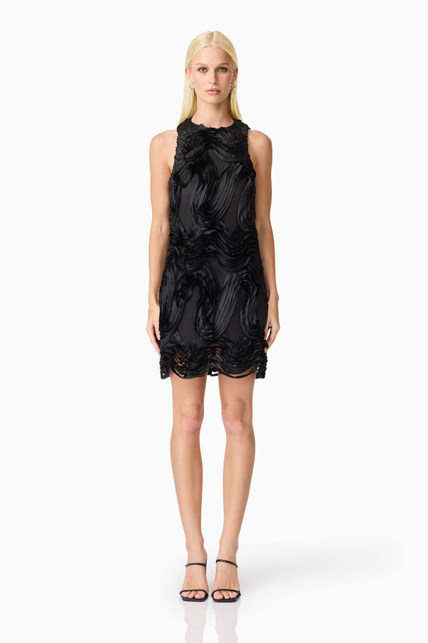 Blonde model wearing Asher Mini Shift Dress in Black front shot