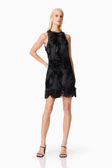 Blonde model wearing Asher Mini Shift Dress in Black posed front shot